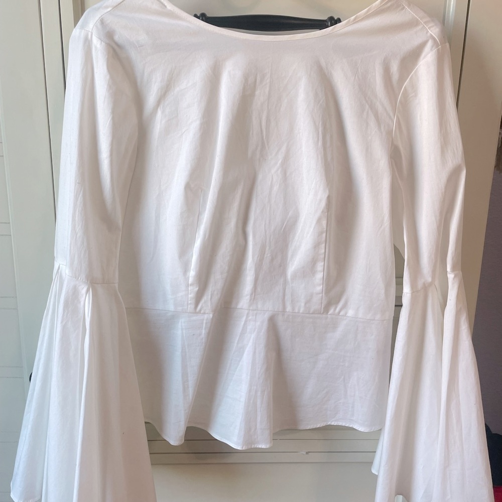 White small size blouse. Brand new with tags